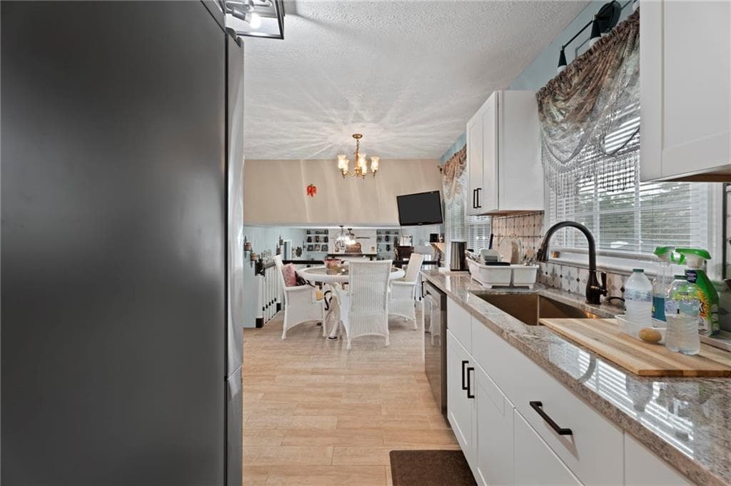 4 bedroom, 3 bathroom, 2,174 sq ft single family residence for sale at 5083 Flakes Mill Road, Ellenwood, GA 30294 — photo 7