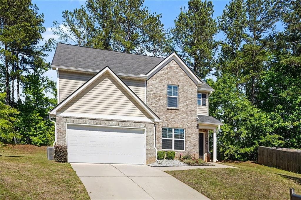 4 bedroom, 3 bathroom, 1,928 sq ft single family residence for sale at 1128 Oak Hollow Lane, Hampton, GA 30228 — photo 2