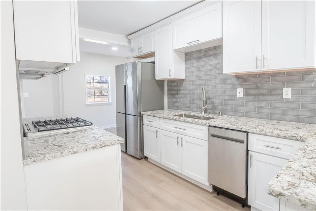 3 bedroom, 2 bathroom, 1,317 sq ft single family residence for sale at 1751 S Olympian Way, Atlanta, GA 30310 — photo 4