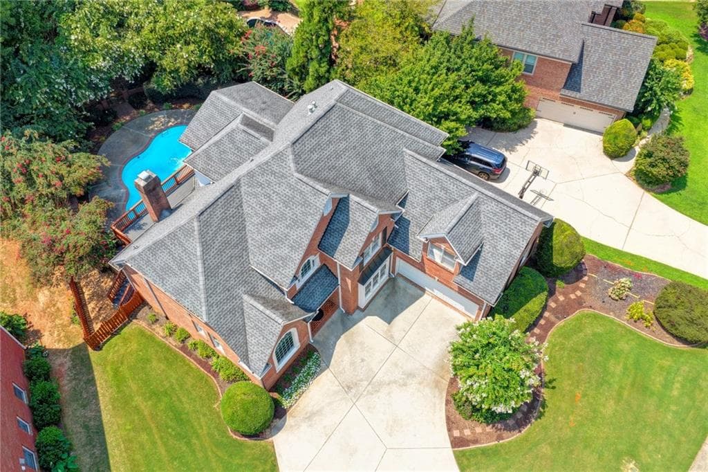 7 bedroom, 5 bathroom, 5,943 sq ft single family residence for sale at 3394 Forestwood Drive, Suwanee, GA 30024