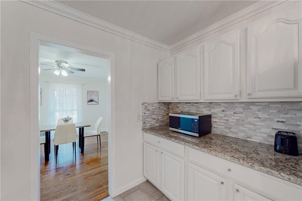 6 bedroom, 4 bathroom, 4,978 sq ft single family residence for sale at 304 W Lakeshore Drive, Carrollton, GA 30117 — photo 8