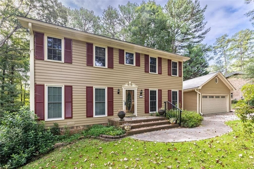 5 bedroom, 4 bathroom, 3,356 sq ft single family residence for sale at 1942 Musket Court, Smoke Rise, GA 30087 — photo 2