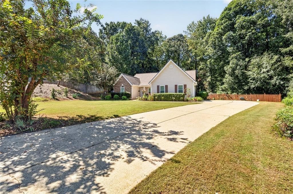 4 bedroom, 2 bathroom, 2,330 sq ft home for sale at 4692 Devencrest Lane, Buford, GA