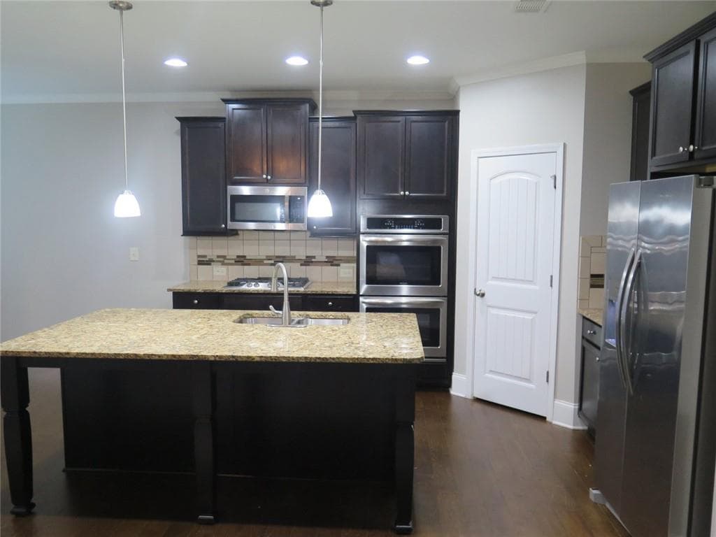 5 bedroom, 3 bathroom, 2,885 sq ft single family residence for sale at 536 Wolf Pack Lane, Atlanta, GA 30349 — photo 8