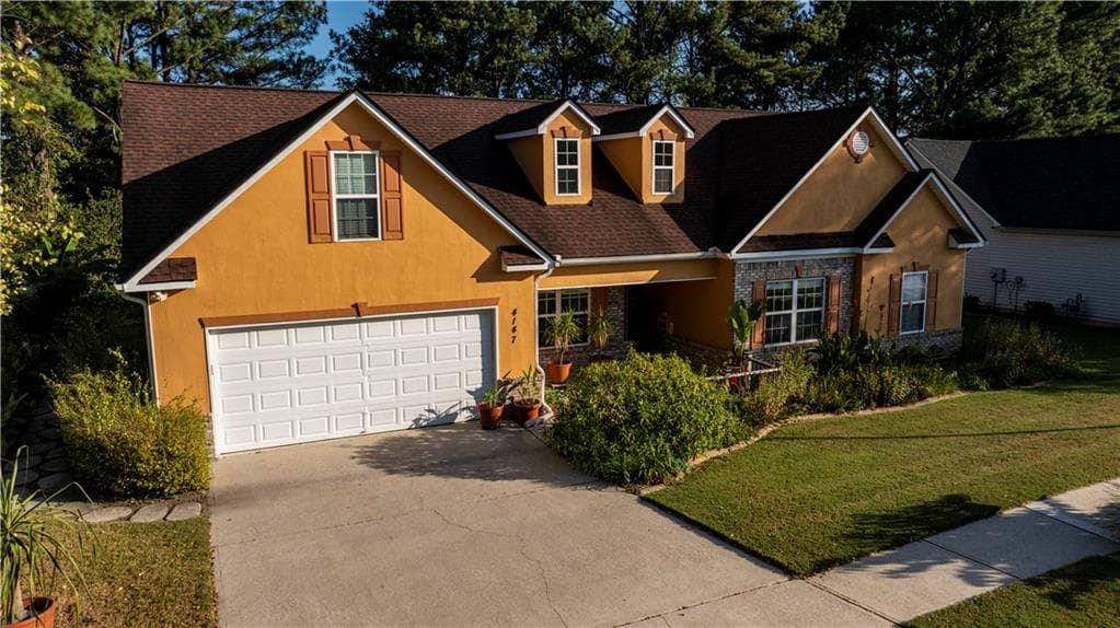 4 bedroom, 3 bathroom, 2,050 sq ft single family residence for sale at 4147 Granite Falls Lane, Loganville, GA 30052 — photo 2