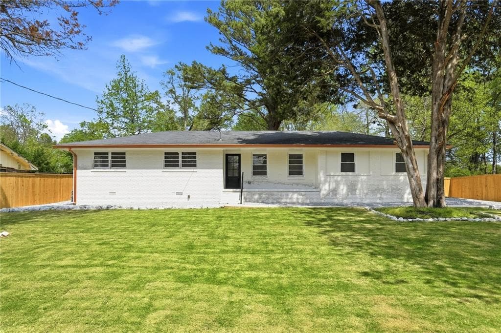 4 bedroom, 3 bathroom, 2,200 sq ft single family residence for sale at 5542 Joeclay Drive, Stone Mountain, GA 30088