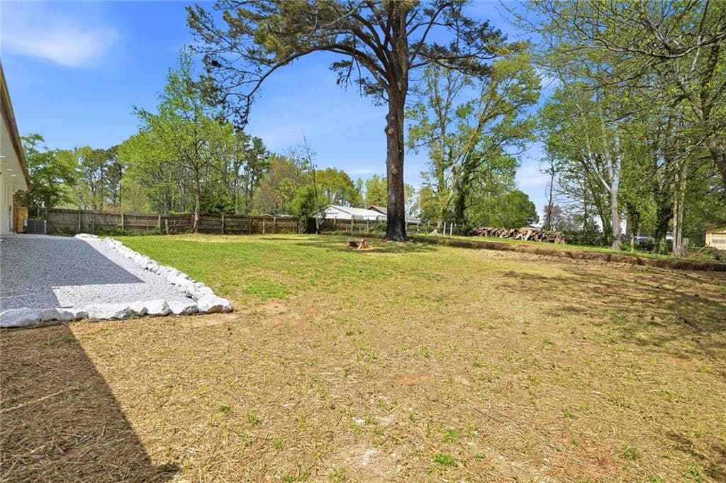 4 bedroom, 3 bathroom, 2,200 sq ft single family residence for sale at 5542 Joeclay Drive, Stone Mountain, GA 30088 — photo 2