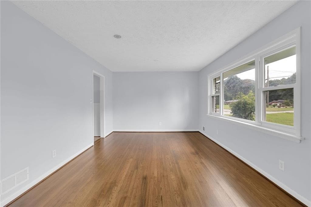 3 bedroom, 2 bathroom, 1,610 sq ft single family residence for sale at 1563 Rockbridge Road, Stone Mountain, GA 30087 — photo 2