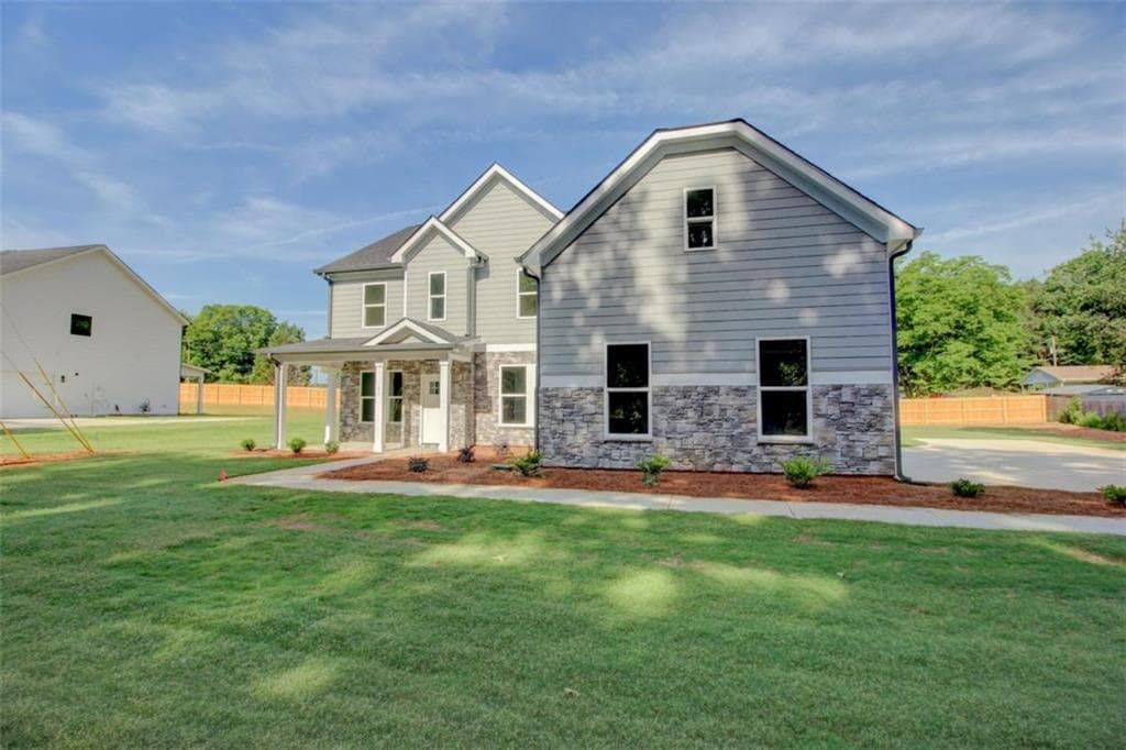 5 bedroom, 4 bathroom, 3,476 sq ft single family residence for sale at 41 Woodland Road, Covington, GA 30016 — photo 2