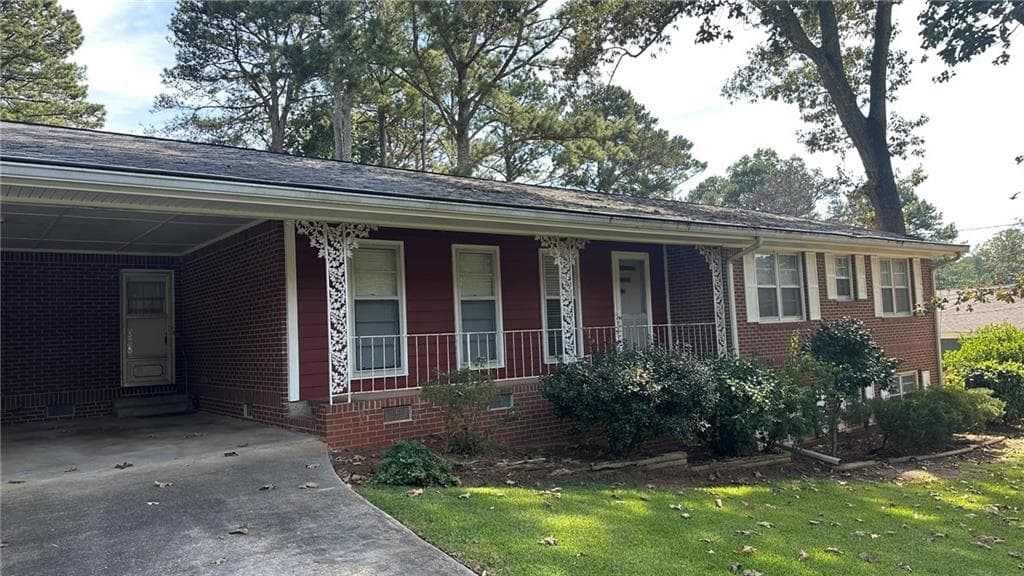 3 bedroom, 2 bathroom, 1,516 sq ft single family residence for sale at 5574 Laurel Lane, Lilburn, GA 30047 — photo 2