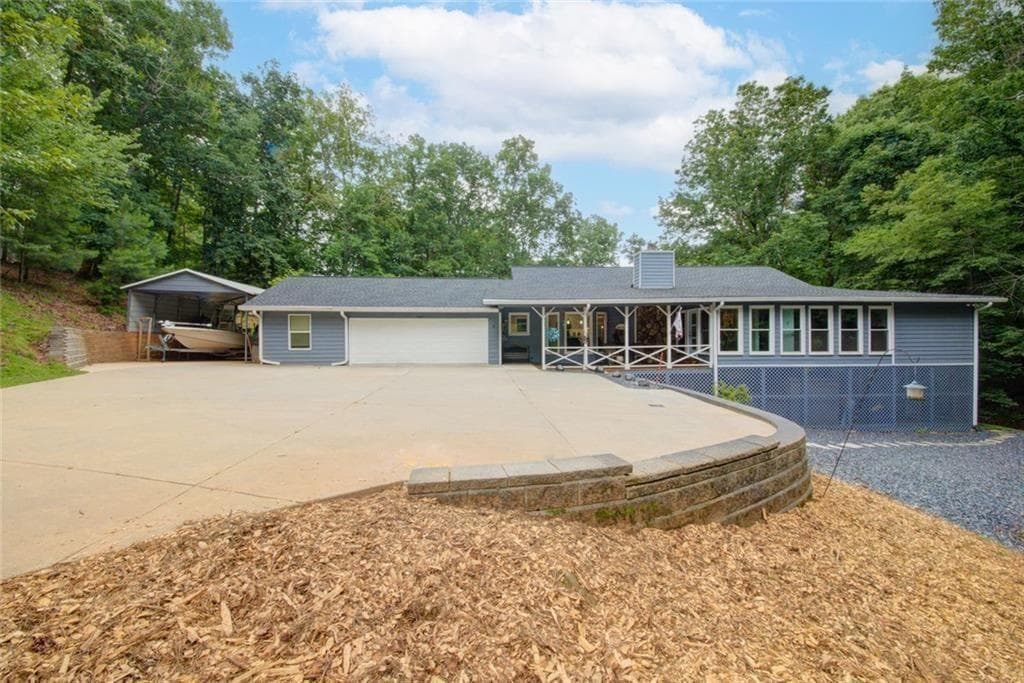 5 bedroom, 4 bathroom, 4,384 sq ft single family residence for sale at 7480 Shadburn Ferry Road, Cumming, GA 30041 — photo 3