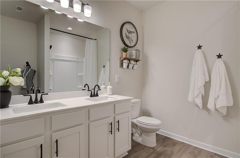 5 bedroom, 4 bathroom, 3,143 sq ft single family residence for sale at 606 Winding Rose Drive, Hoschton, GA 30548 — photo 4