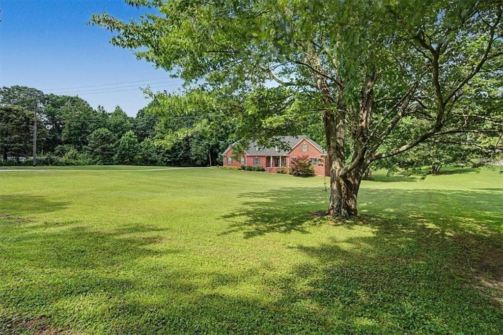 6 bedroom, 3 bathroom, 5,470 sq ft single family residence for sale at 994 Rainey Road, Temple, GA 30179 — photo 6