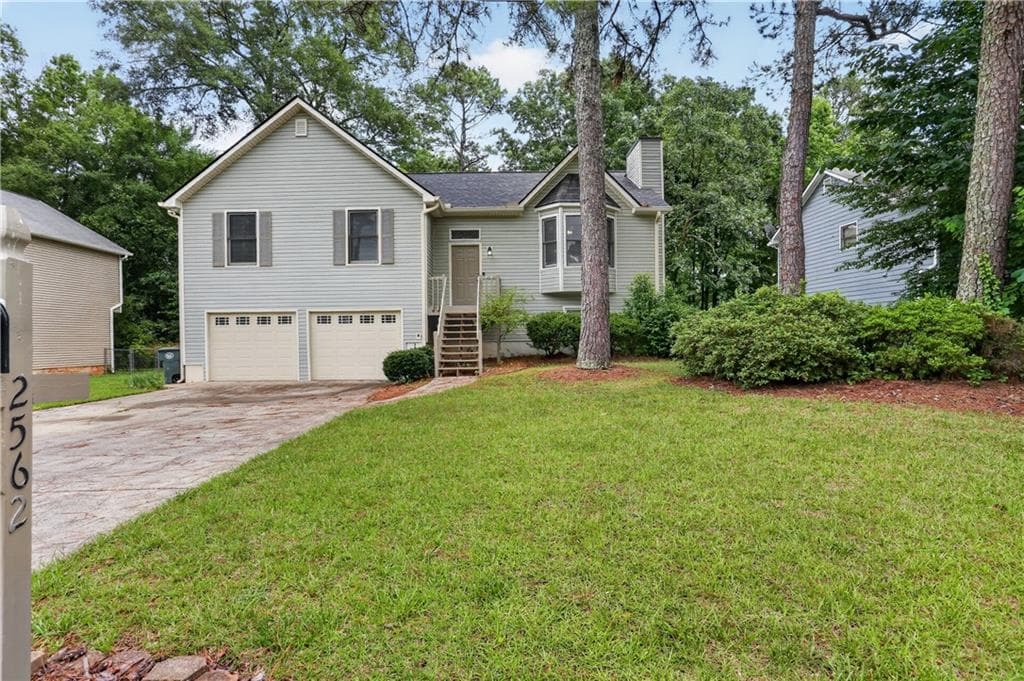 4 bedroom, 2 bathroom, 2,252 sq ft single family residence for sale at 2562 Kennesaw Springs Court, Kennesaw, GA 30144 — photo 2