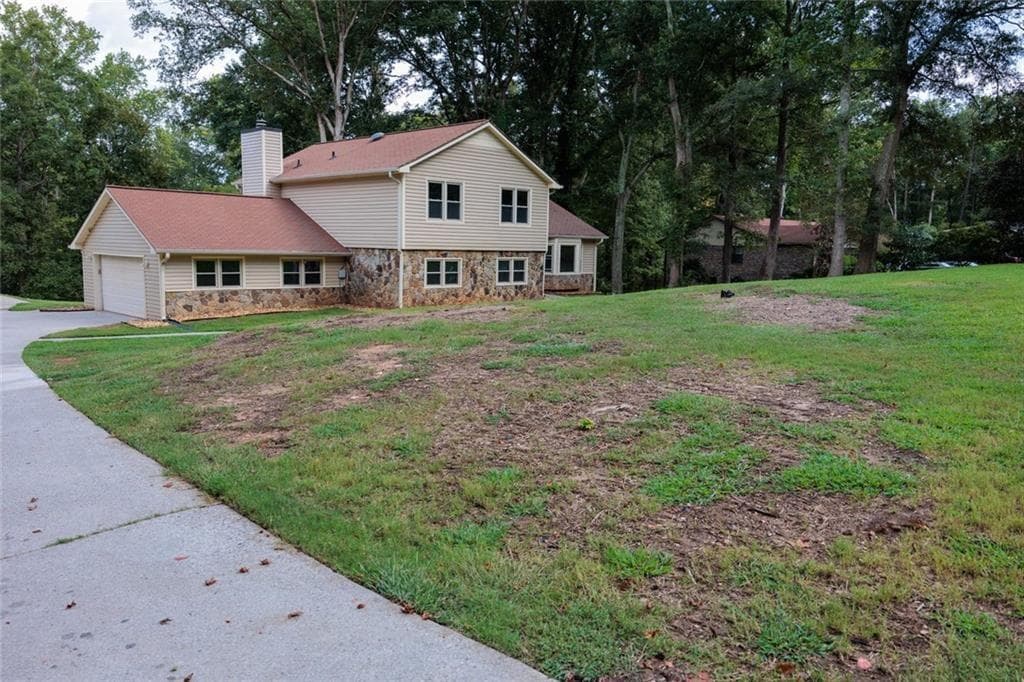 4 bedroom, 3 bathroom, 2,307 sq ft single family residence for sale at 551 Covered Bridge Trail, Fayetteville, GA 30214 — photo 2