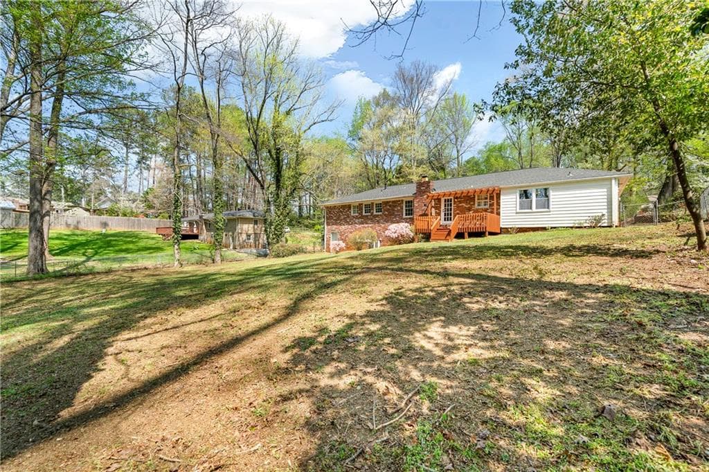4 bedroom, 3 bathroom, 2,587 sq ft single family residence for sale at 155 King David Drive, Lilburn, GA 30047 — photo 3