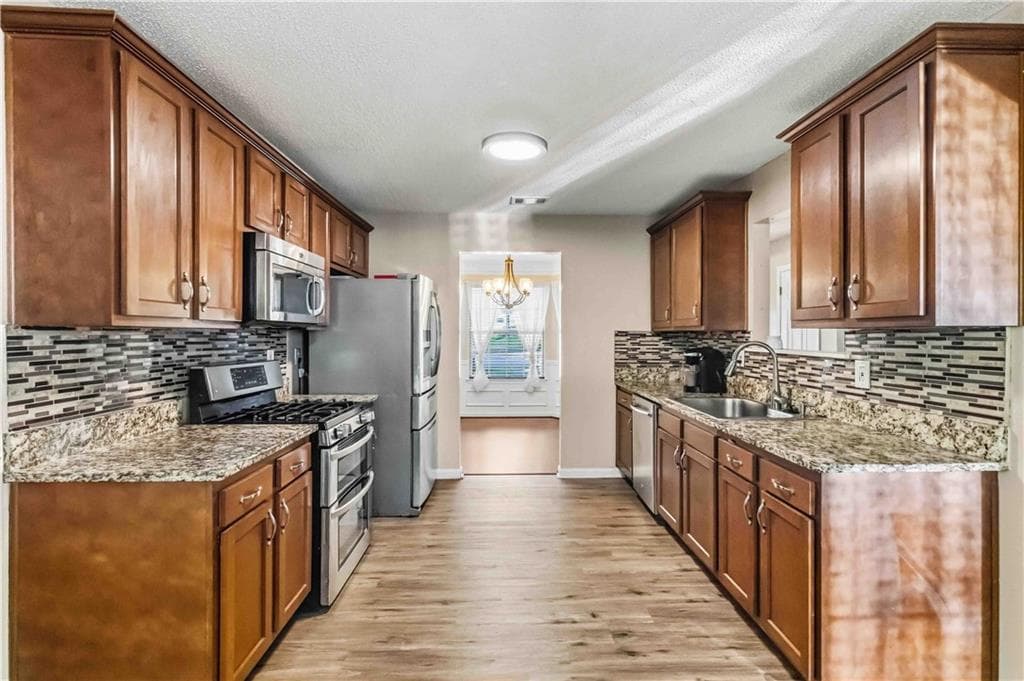 4 bedroom, 3 bathroom, 1,940 sq ft single family residence for sale at 2608 Micah Drive, Ellenwood, GA 30294 — photo 4