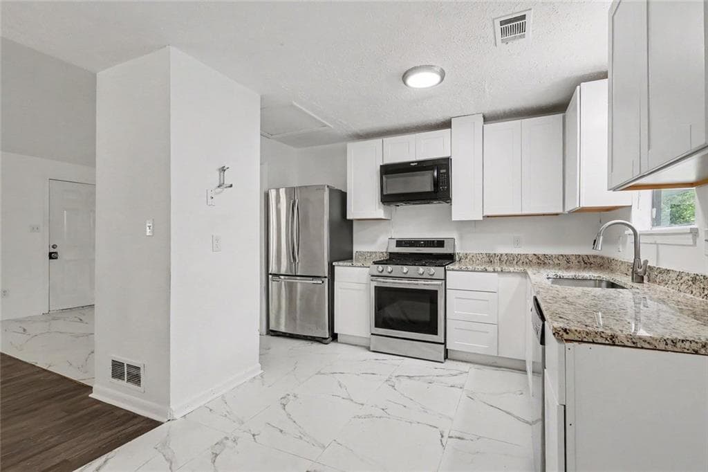 3 bedroom, 2 bathroom, 1,428 sq ft single family residence for sale at 5880 Bluebonnet Circle, College Park, GA 30349 — photo 3