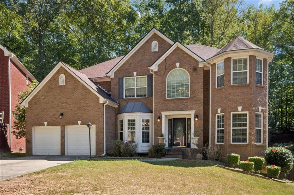 7 bedroom, 5 bathroom, 5,452 sq ft single family residence for sale at 7627 Waterlace Drive, Fairburn, GA 30213 — photo 2