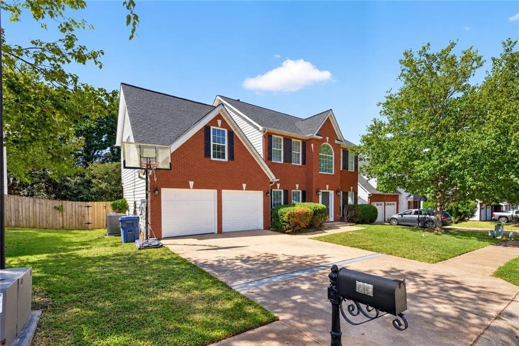 4 bedroom, 3 bathroom, 2,585 sq ft single family residence for sale at 1312 Woodland View Road, Lawrenceville, GA 30043 — photo 2
