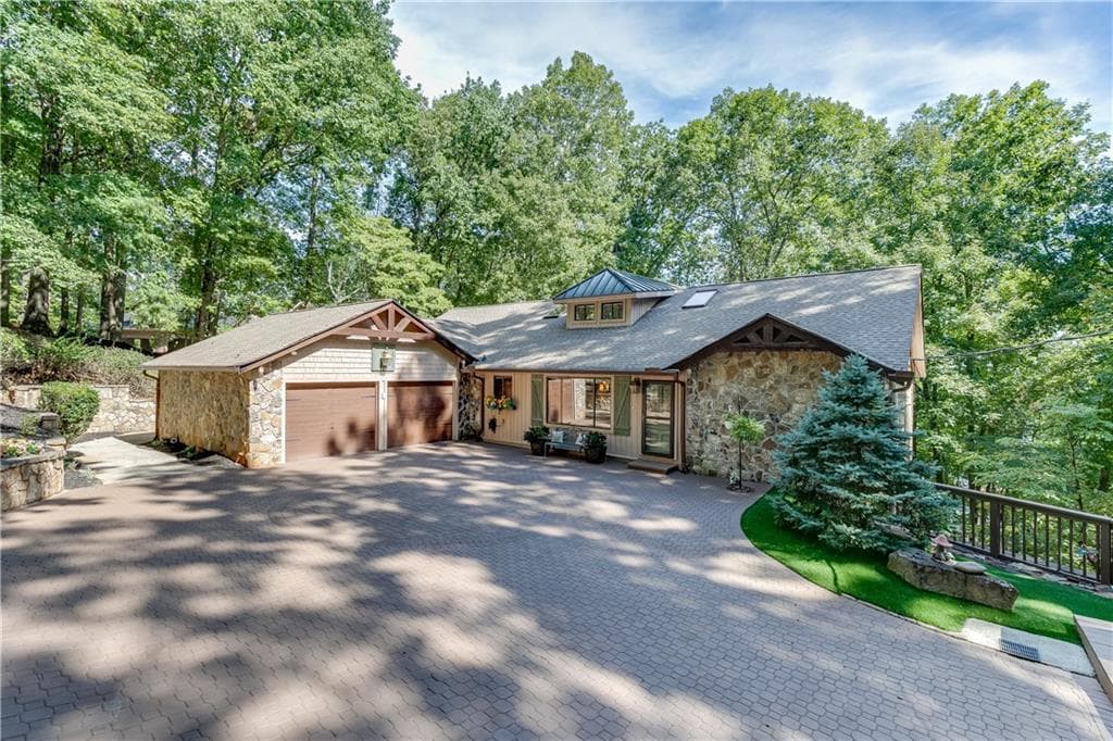 7 bedroom, 4 bathroom, 6,198 sq ft single family residence for sale at 7565 Shadburn Ferry Road, Cumming, GA 30041