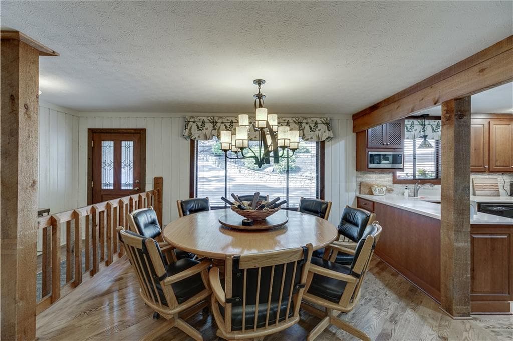 7 bedroom, 4 bathroom, 6,198 sq ft single family residence for sale at 7565 Shadburn Ferry Road, Cumming, GA 30041 — photo 5