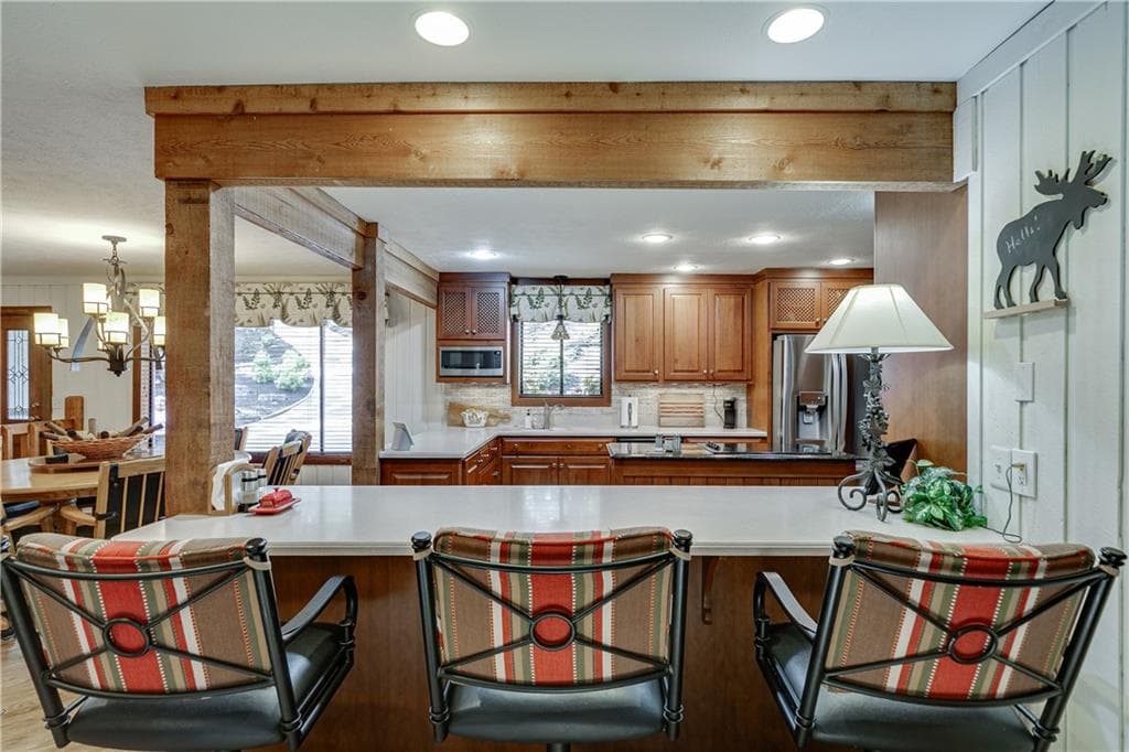 7 bedroom, 4 bathroom, 6,198 sq ft single family residence for sale at 7565 Shadburn Ferry Road, Cumming, GA 30041 — photo 8