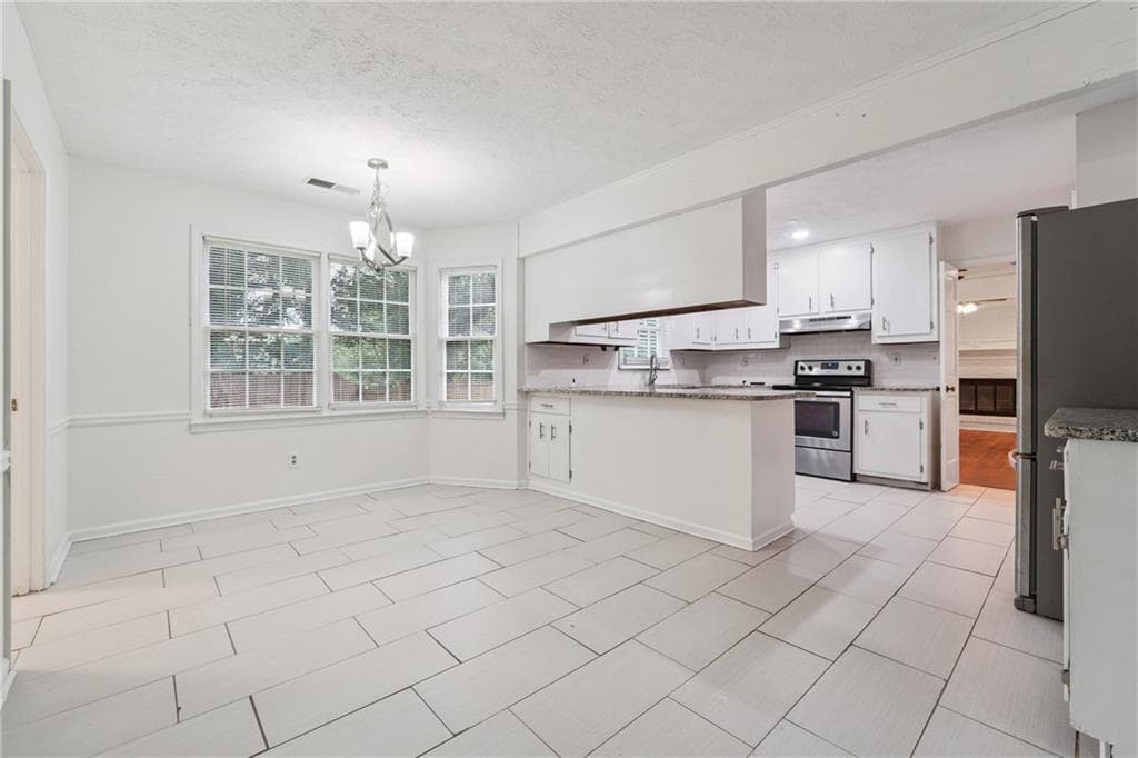 4 bedroom, 3 bathroom, 2,464 sq ft single family residence for sale at 1416 Manchester Court, Lilburn, GA 30047 — photo 6