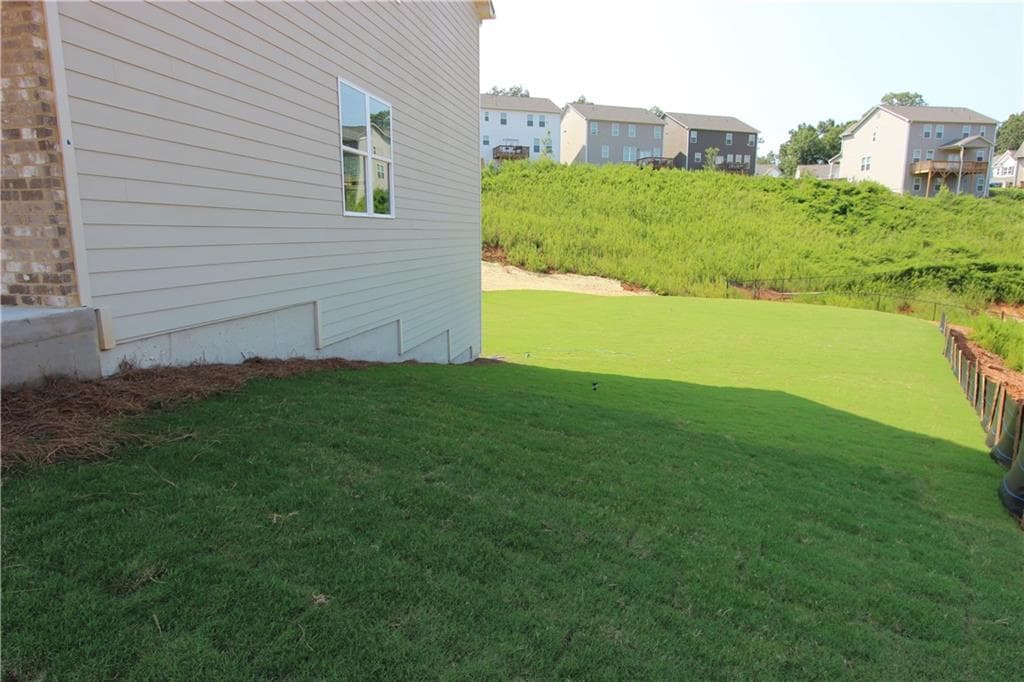 4 bedroom, 3 bathroom, 2,428 sq ft single family residence for sale at 7431 Rocklin Lane, Flowery Branch, GA 30542 — photo 2
