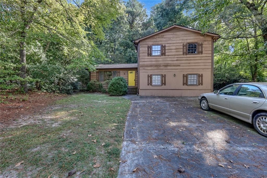 3 bedroom, 2 bathroom, 2,796 sq ft single family residence for sale at 1466 Hewatt Road, Lilburn, GA 30047 — photo 2