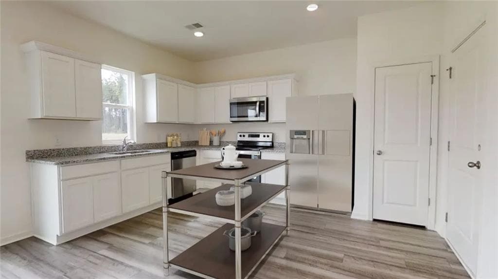 4 bedroom, 3 bathroom, 1,801 sq ft single family residence for sale at 302 Knightsbridge Lane, Winder, GA 30680 — photo 8
