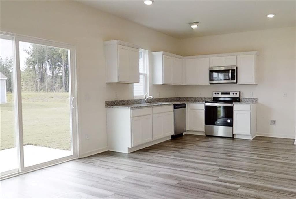 4 bedroom, 3 bathroom, 1,801 sq ft single family residence for sale at 302 Knightsbridge Lane, Winder, GA 30680 — photo 9