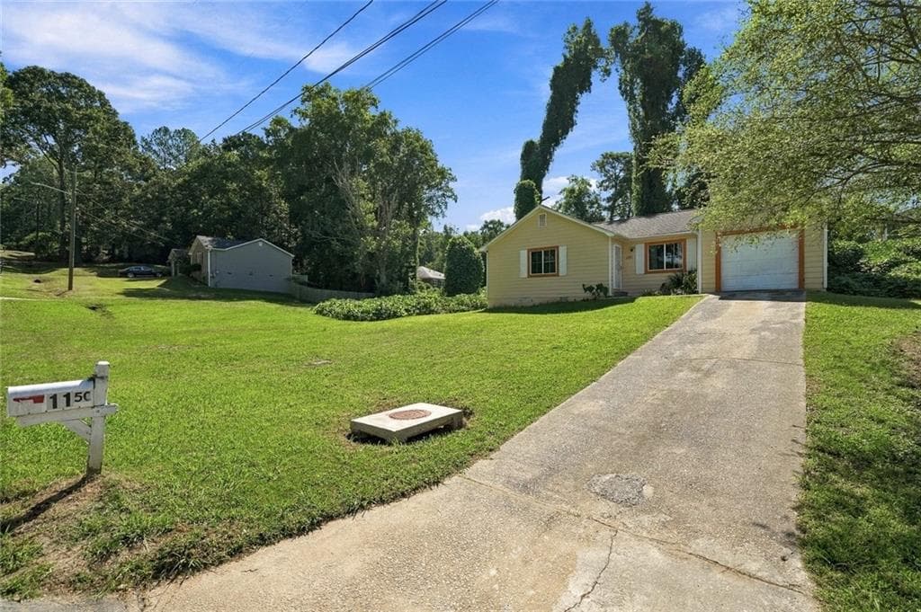 5 bedroom, 4 bathroom, 1,136 sq ft single family residence for sale at 1150 Crystal Lake Road, Atlanta, GA 30349 — photo 2