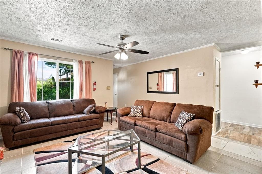 5 bedroom, 4 bathroom, 1,136 sq ft single family residence for sale at 1150 Crystal Lake Road, Atlanta, GA 30349 — photo 3