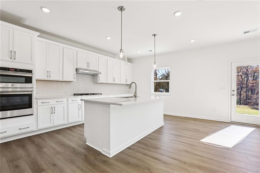5 bedroom, 4 bathroom, 3,358 sq ft single family residence for sale at 6234 Kismet Road, Buford, GA 30518 — photo 8