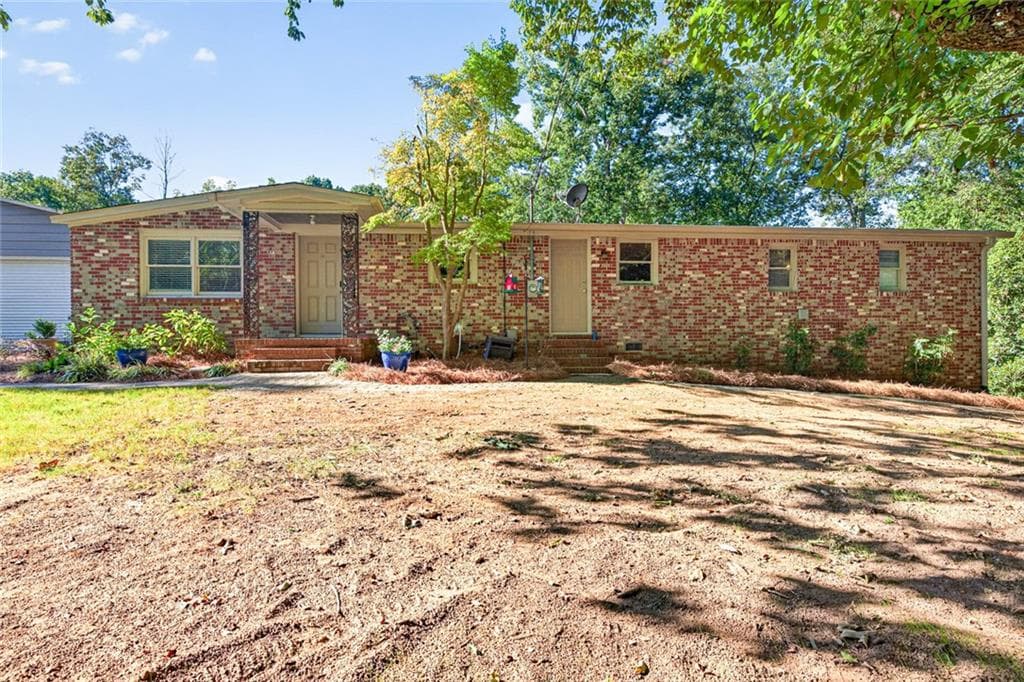 4 bedroom, 3 bathroom home for sale at 3076 Thompson Mill Road, Buford, GA
