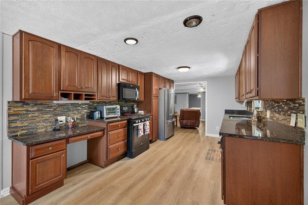 4 bedroom, 3 bathroom single family residence for sale at 3076 Thompson Mill Road, Buford, GA 30519 — photo 8