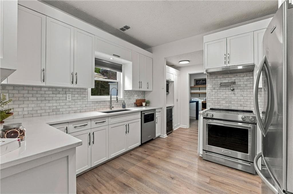4 bedroom, 3 bathroom, 2,340 sq ft single family residence for sale at 3400 Duncan Bridge Drive, Buford, GA 30519 — photo 3