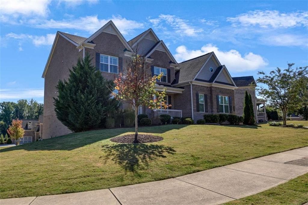 5 bedroom, 4 bathroom, 4,375 sq ft single family residence for sale at 5980 Roxboro Court, Cumming, GA 30040 — photo 4