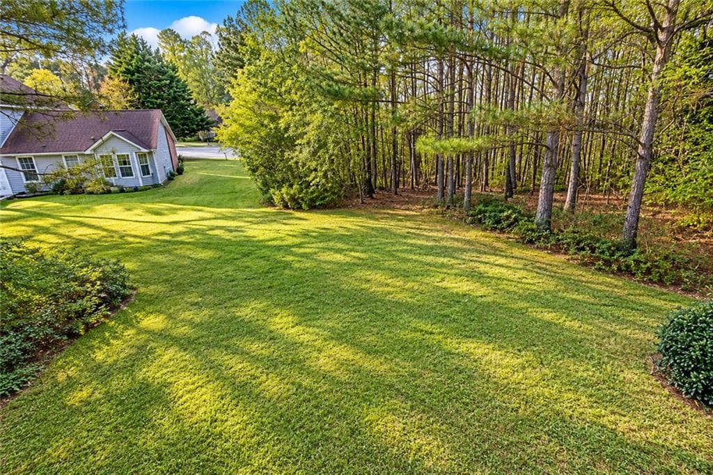 6 bedroom, 4 bathroom, 3,151 sq ft single family residence for sale at 3635 Spring Mesa Drive, Snellville, GA 30039 — photo 6