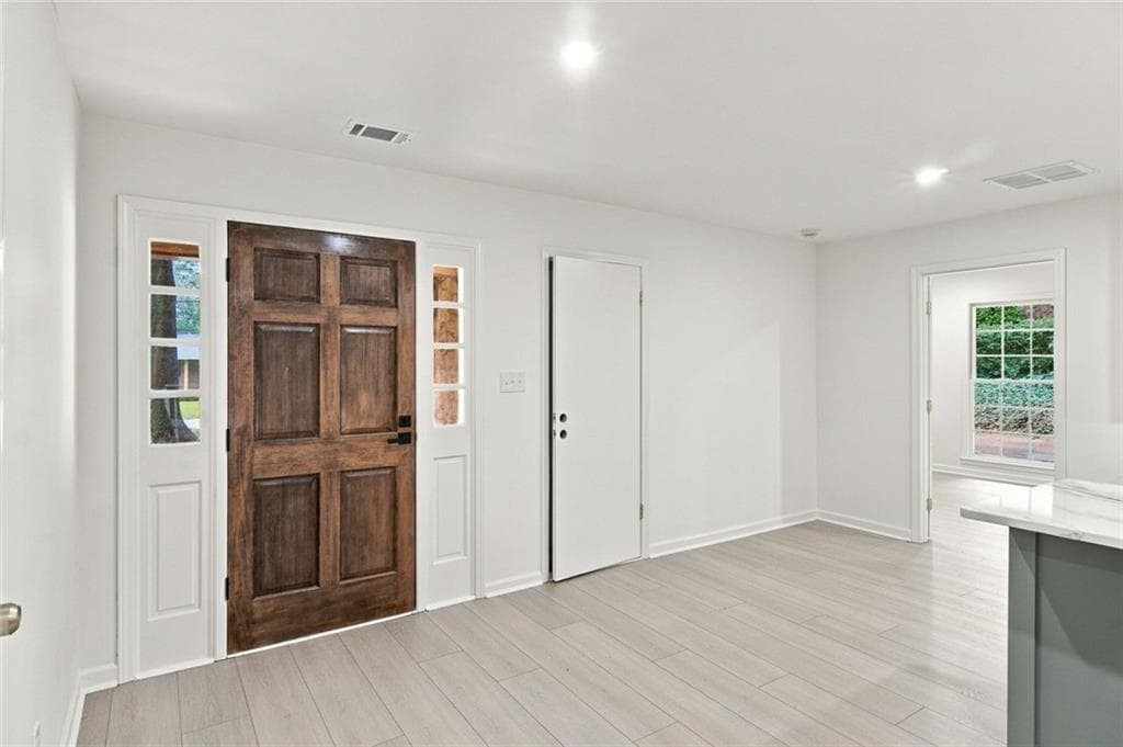 4 bedroom, 3 bathroom, 1,716 sq ft single family residence for sale at 645 Noell Way, Lilburn, GA 30047 — photo 4