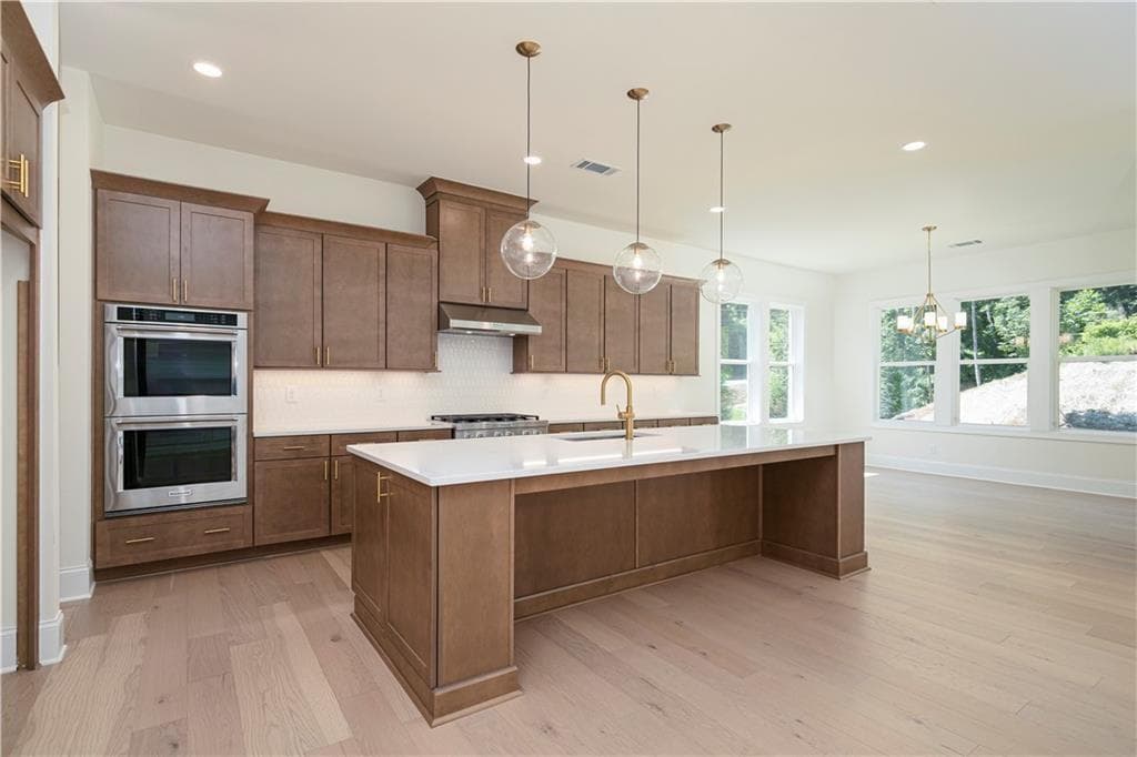 5 bedroom, 6 bathroom, 3,341 sq ft single family residence for sale at 2405 Bleckley Place, Cumming, GA 30041 — photo 5
