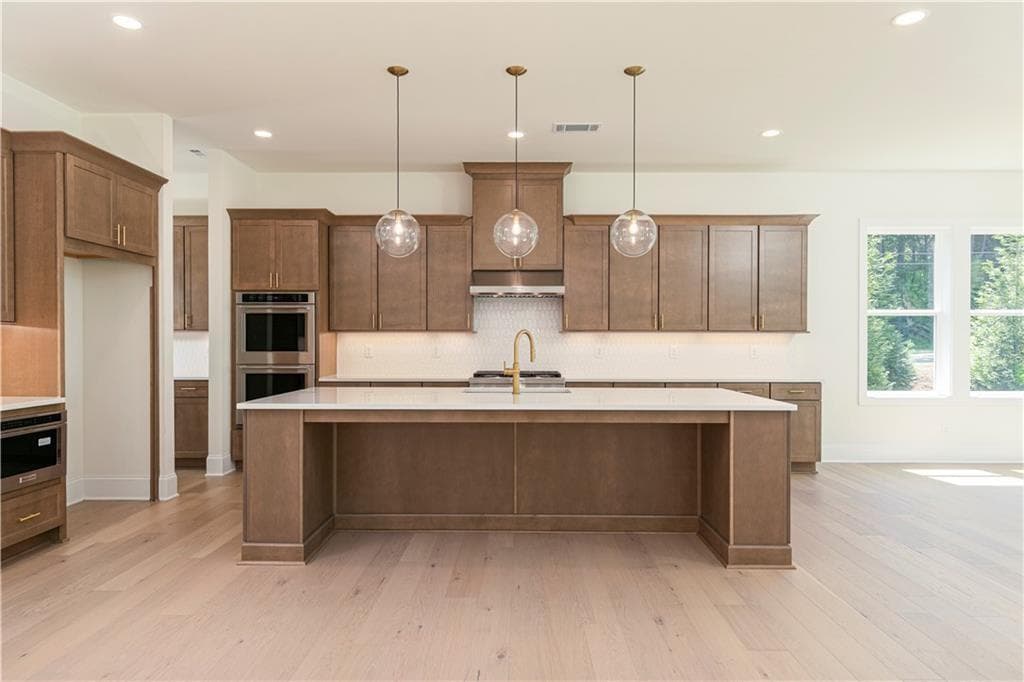 5 bedroom, 6 bathroom, 3,341 sq ft single family residence for sale at 2405 Bleckley Place, Cumming, GA 30041 — photo 7