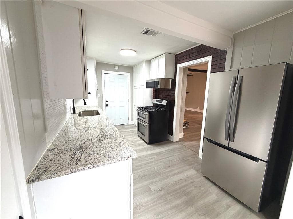 4 bedroom, 2 bathroom, 1,614 sq ft single family residence for sale at 1268 Woodland Road, Conyers, GA 30012 — photo 6