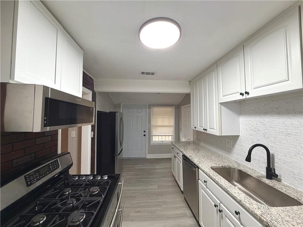 4 bedroom, 2 bathroom, 1,614 sq ft single family residence for sale at 1268 Woodland Road, Conyers, GA 30012 — photo 7