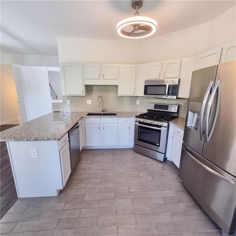 3 bedroom, 4 bathroom, 1,841 sq ft townhouse for sale at 2162 Mill Garden Run, Buford, GA 30519 — photo 2
