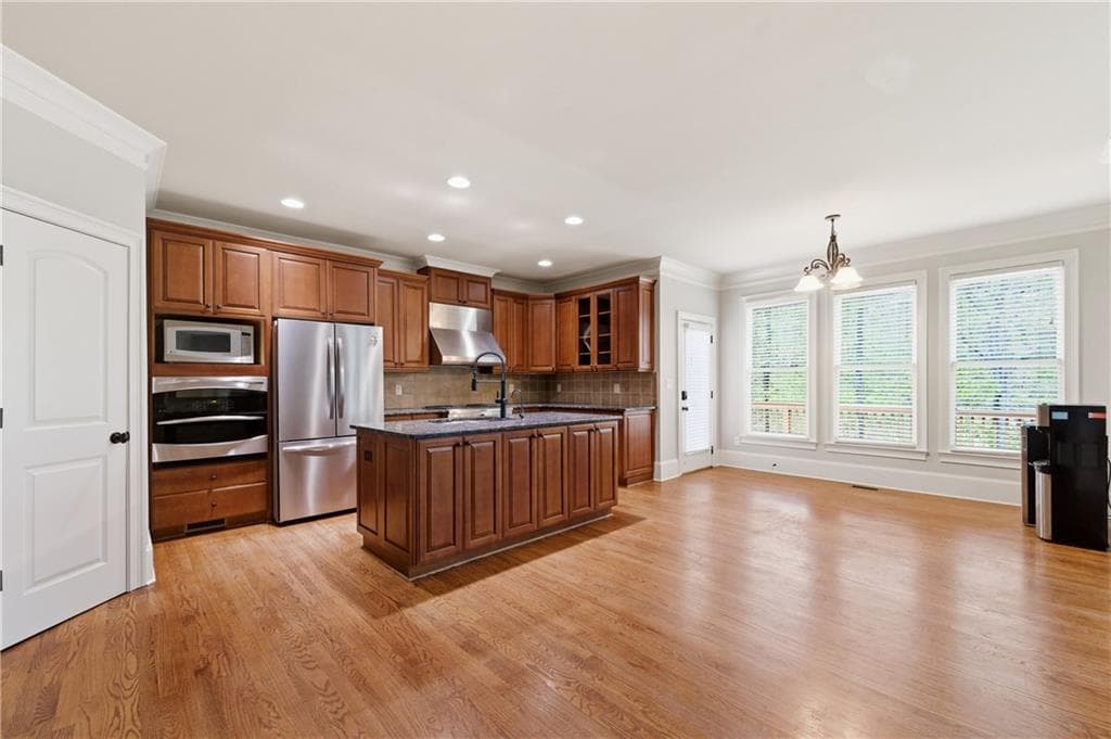 6 bedroom, 5 bathroom, 4,558 sq ft single family residence for sale at 3196 Nours Landing Circle, Duluth, GA 30097 — photo 9