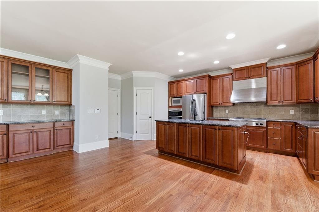 6 bedroom, 5 bathroom, 4,558 sq ft single family residence for sale at 3196 Nours Landing Circle, Duluth, GA 30097 — photo 10