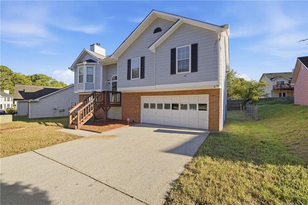 4 bedroom, 3 bathroom, 1,923 sq ft single family residence for sale at 5527 Tunbridge Wells Road, Lithonia, GA 30058 — photo 2