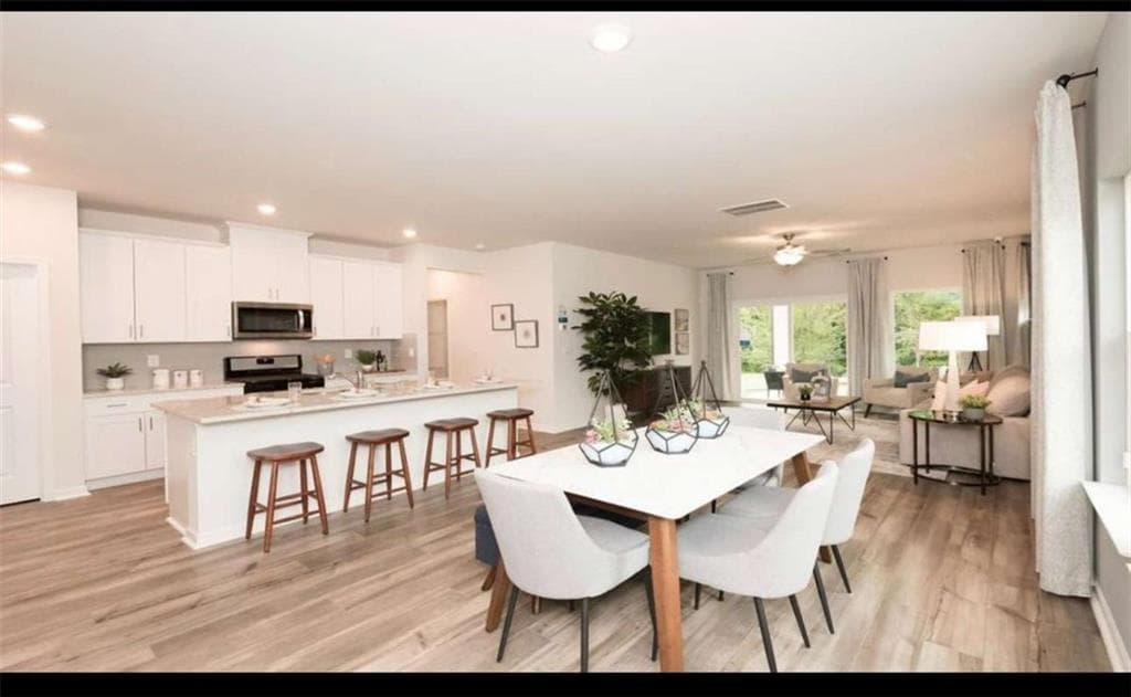 5 bedroom, 3 bathroom, 2,420 sq ft single family residence for sale at 104 NESBIT Drive, Holly Springs, GA 30114 — photo 5